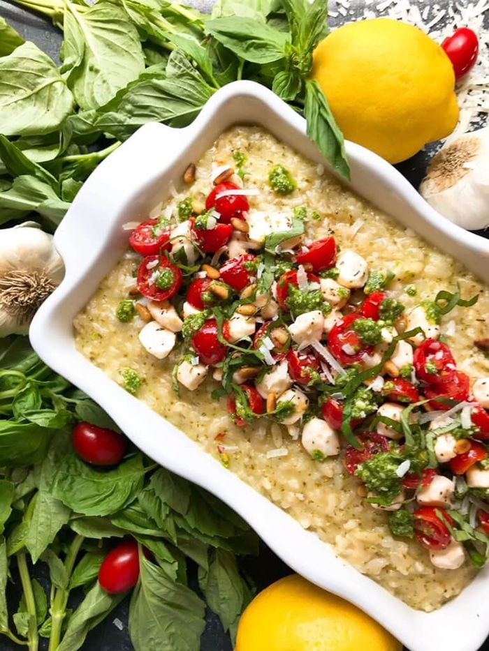 risotto topped with tomato mozzarella and fresh basil