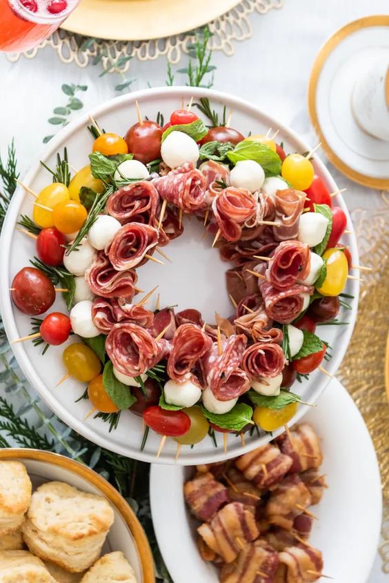 caprese antipasta salad formed into a wreath on a platter