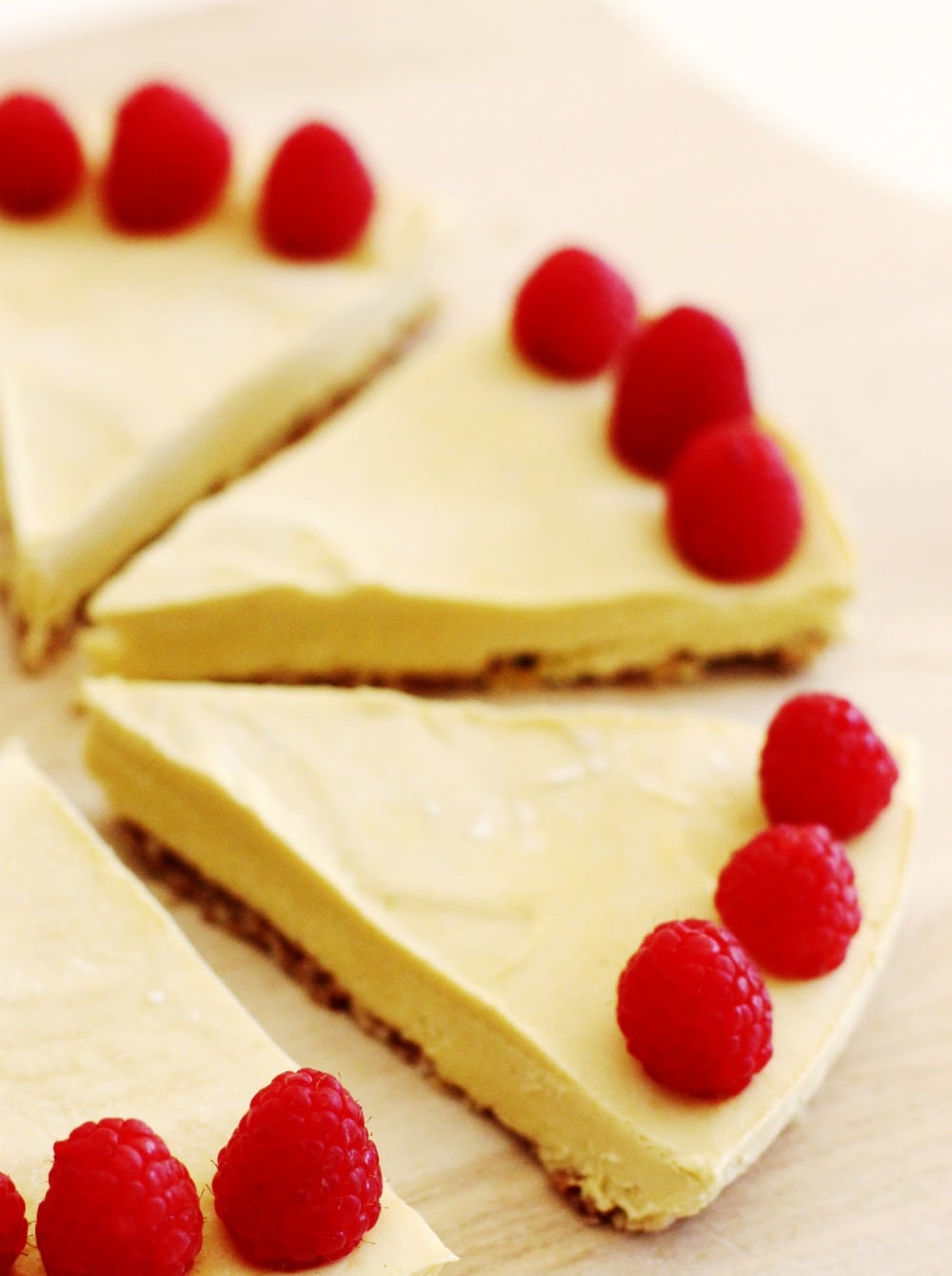 No-Bake Raw Vegan Mango Raspberry Cheesecake Recipe slices