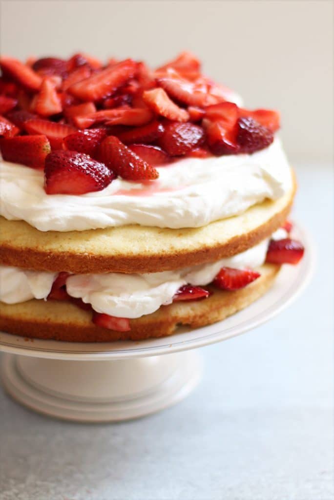 cake with strawberries and whipped cream